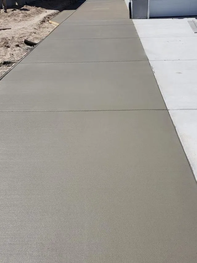 Freshly finished concrete driveway at a new construction home